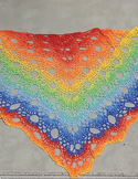Colorful crocheted shawl featuring a rainbow gradient and circular pattern.