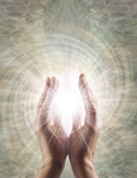 6. Open hands glowing with soft light against a radiant, swirling background.