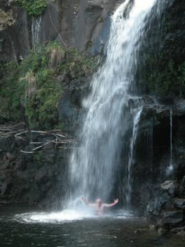 One of the waterfalls at  Seven Sacred Pools.  Yes that's me under the falls.