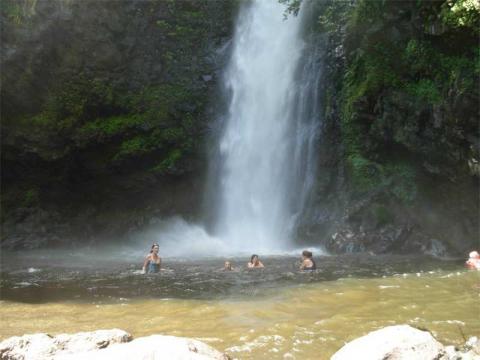 Swimming under the waterfall