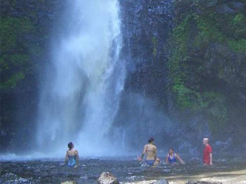 Swimming under the waterfall